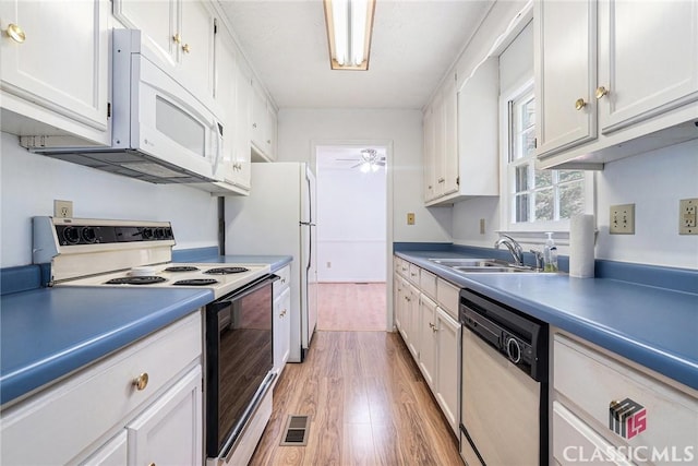 148 Hunters Crossing Rd, Athens, GA 30606 - kitchen featuring white appliances, light wood finished floors, ceiling fan, white cabinetry, and light countertops