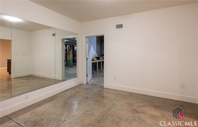 497 W Rutherford St, Athens, GA 30606 - empty room with concrete floors and baseboards