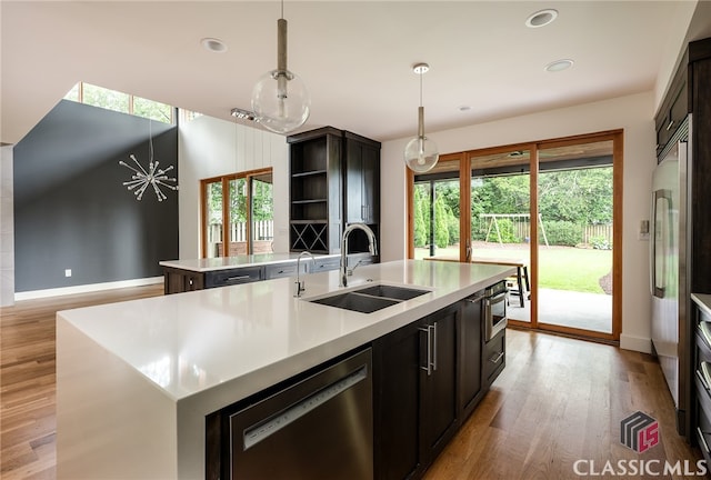 497 W Rutherford St, Athens, GA 30606 - kitchen featuring a center island with sink, dishwasher, plenty of natural light, light wood-style floors, and recessed lighting