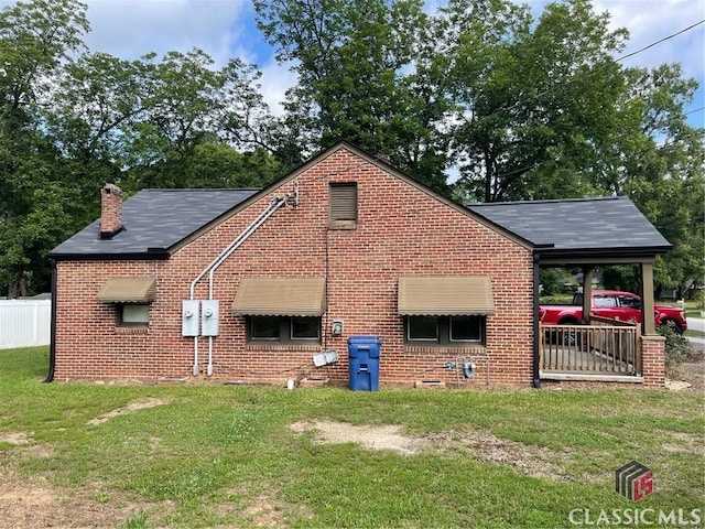 49 New St E, Winder, GA 30680 - view of side of home with brick siding and a chimney