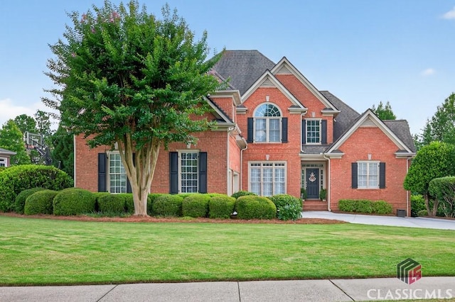 1232 Everton Pl, Cumming, GA 30041 - view of front facade featuring brick siding and a front lawn