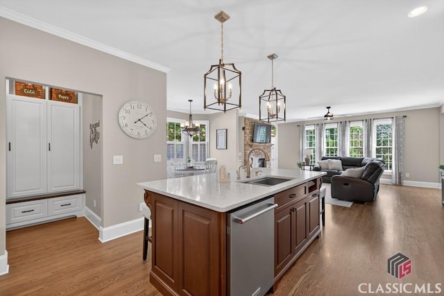 1232 Everton Pl, Cumming, GA 30041 - kitchen with stainless steel dishwasher, a chandelier, dark wood-style flooring, light countertops, and healthy amount of natural light