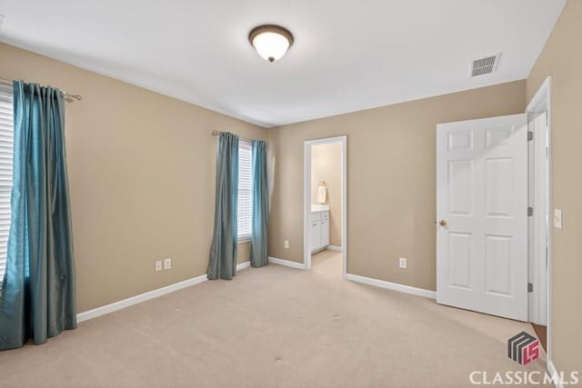 1232 Everton Pl, Cumming, GA 30041 - unfurnished bedroom featuring light colored carpet and ensuite bathroom