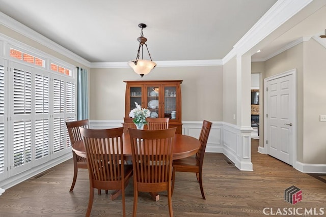 1232 Everton Pl, Cumming, GA 30041 - dining area featuring dark wood-style floors, ornamental molding, and a wainscoted wall