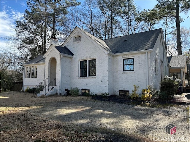 525 King Ave, Athens, GA 30606 - french country inspired facade with brick siding, roof with shingles, and a chimney