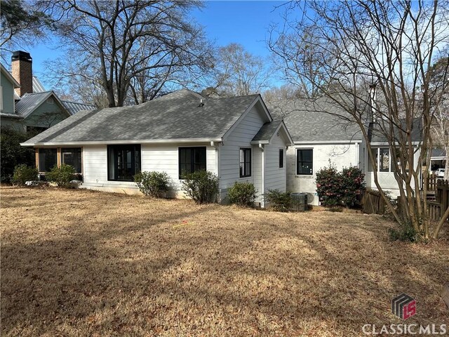 525 King Ave, Athens, GA 30606 - view of front of house with a shingled roof, a chimney, and a front yard