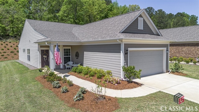 1260 Starboard Way, Greensboro, GA 30642 - view of front of property featuring roof with shingles, a garage, a front yard, and concrete driveway