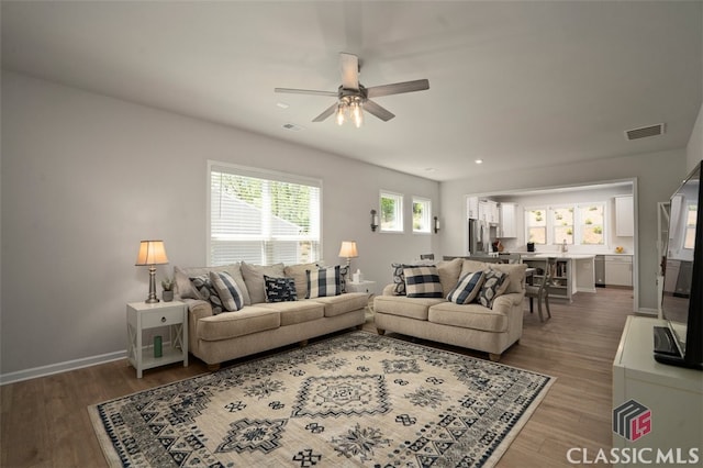 1260 Starboard Way, Greensboro, GA 30642 - living room with a ceiling fan and wood finished floors