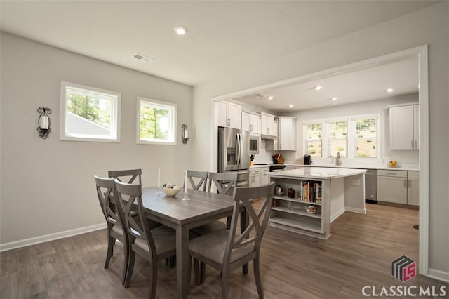 1260 Starboard Way, Greensboro, GA 30642 - dining space with wood finished floors, plenty of natural light, and recessed lighting