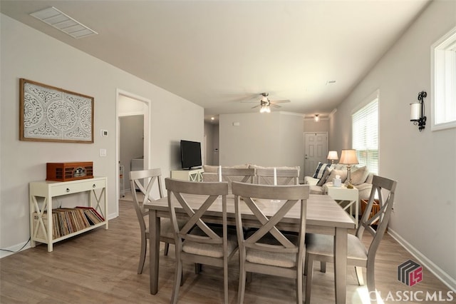 1260 Starboard Way, Greensboro, GA 30642 - dining space with light wood-style floors and ceiling fan