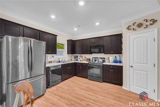 263 Turtle Creek Dr, Winder, GA 30680 - kitchen featuring black appliances, dark brown cabinets, light countertops, ornamental molding, and light wood-type flooring