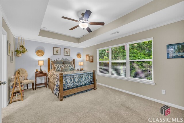 263 Turtle Creek Dr, Winder, GA 30680 - carpeted bedroom with a tray ceiling, a ceiling fan, and crown molding