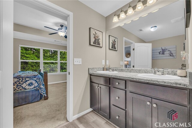 263 Turtle Creek Dr, Winder, GA 30680 - bathroom featuring double vanity, ceiling fan, ensuite bathroom, and wood finished floors