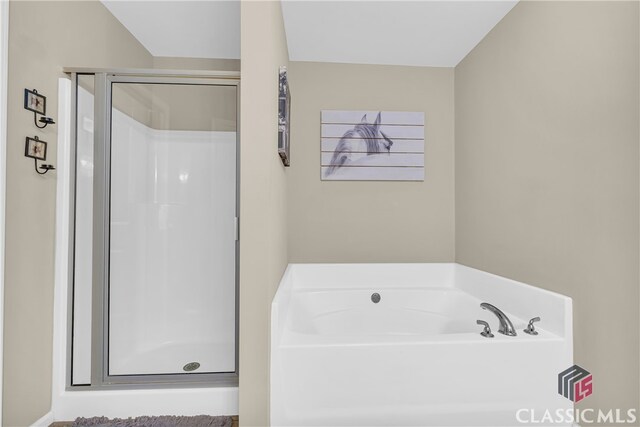 263 Turtle Creek Dr, Winder, GA 30680 - full bathroom with a stall shower and a garden tub