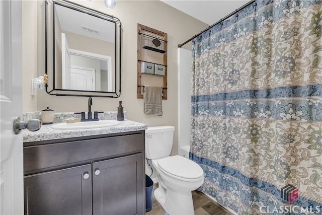 263 Turtle Creek Dr, Winder, GA 30680 - full bath featuring vanity, shower / bath combo, and wood finished floors