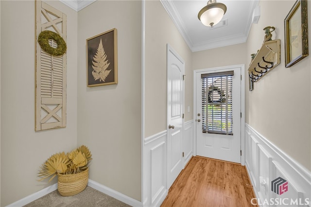 263 Turtle Creek Dr, Winder, GA 30680 - entryway featuring ornamental molding, wainscoting, light wood-style floors, and a decorative wall