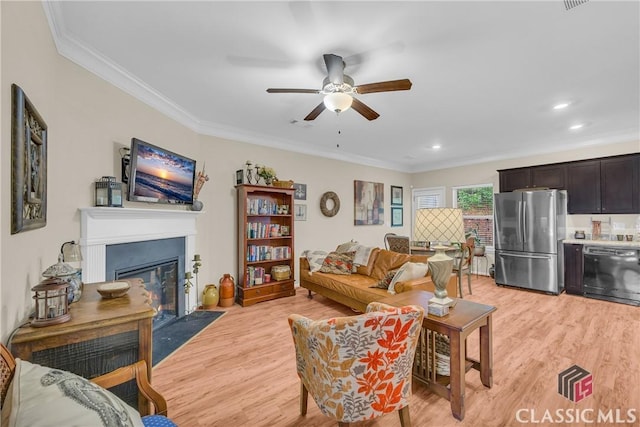 263 Turtle Creek Dr, Winder, GA 30680 - living area with a fireplace with flush hearth, light wood-style floors, crown molding, a ceiling fan, and recessed lighting