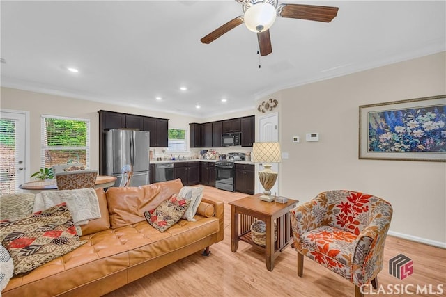 263 Turtle Creek Dr, Winder, GA 30680 - living room with light wood-style floors, crown molding, recessed lighting, and ceiling fan