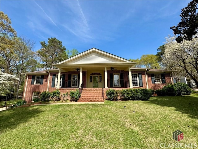 270 Riverhill Dr, Athens, GA 30606 - view of front of house with a ceiling fan, brick siding, covered porch, and a front lawn