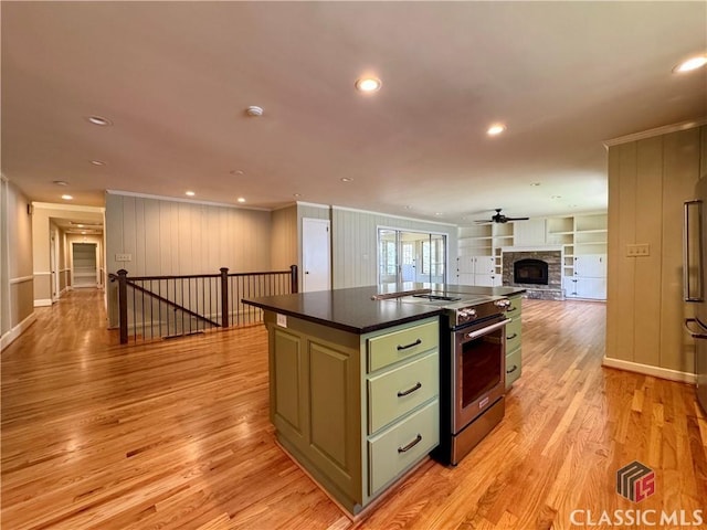 270 Riverhill Dr, Athens, GA 30606 - kitchen featuring stainless steel appliances, green cabinets, dark countertops, open floor plan, and ornamental molding