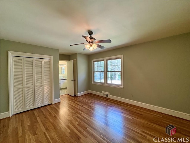 270 Riverhill Dr, Athens, GA 30606 - unfurnished bedroom with wood finished floors, a closet, and ceiling fan