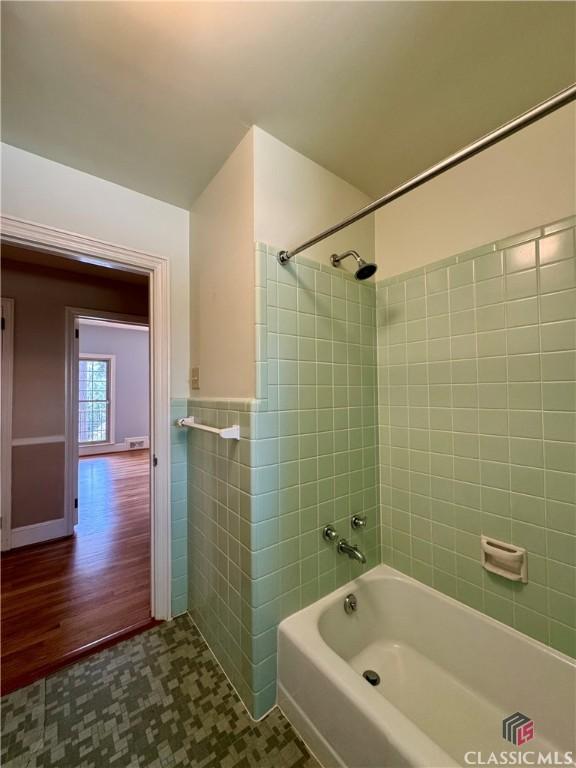270 Riverhill Dr, Athens, GA 30606 - bathroom featuring bathtub / shower combination, tile walls, wainscoting, and wood finished floors