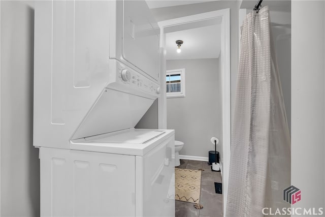 1376 Hancock Ave W, Athens, GA 30606 - bathroom with stacked washing machine and dryer and tile patterned floors