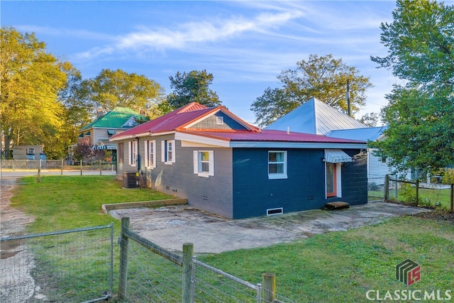 1376 Hancock Ave W, Athens, GA 30606 - view of side of home with a fenced backyard, a patio area, a metal roof, and a gate