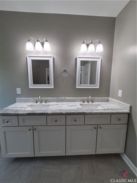 1090 Fox Glen Dr, Watkinsville, GA 30677 - bathroom with double vanity and baseboards