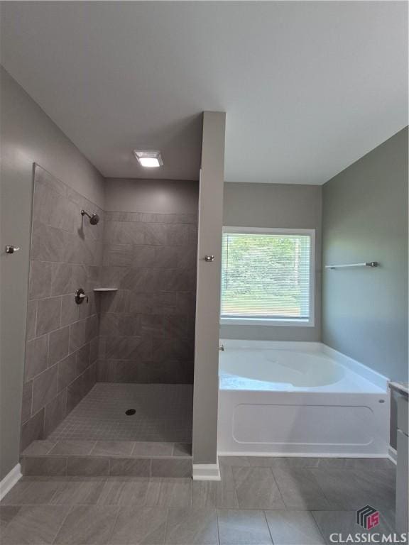 1090 Fox Glen Dr, Watkinsville, GA 30677 - full bathroom with a bath, tiled shower, and tile patterned flooring