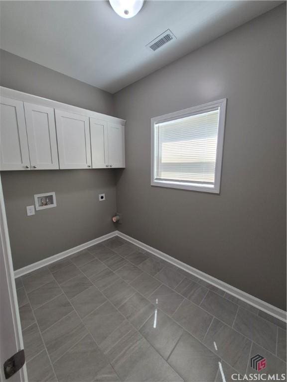 1090 Fox Glen Dr, Watkinsville, GA 30677 - laundry area featuring hookup for a washing machine, electric dryer hookup, cabinet space, and gas dryer hookup
