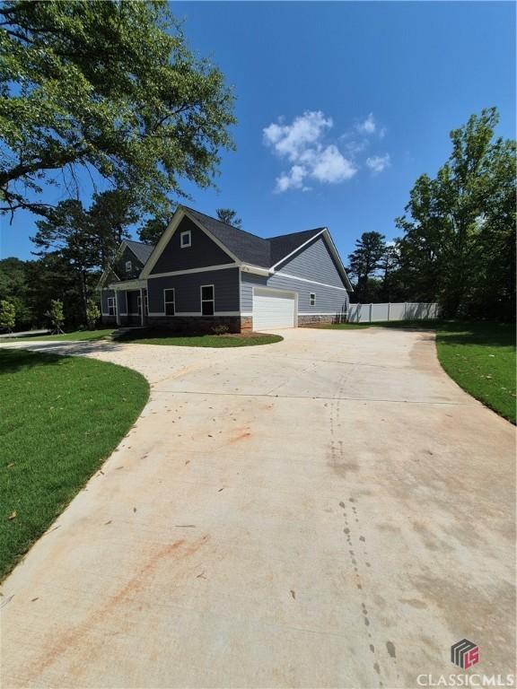 1090 Fox Glen Dr, Watkinsville, GA 30677 - craftsman inspired home featuring driveway and a garage