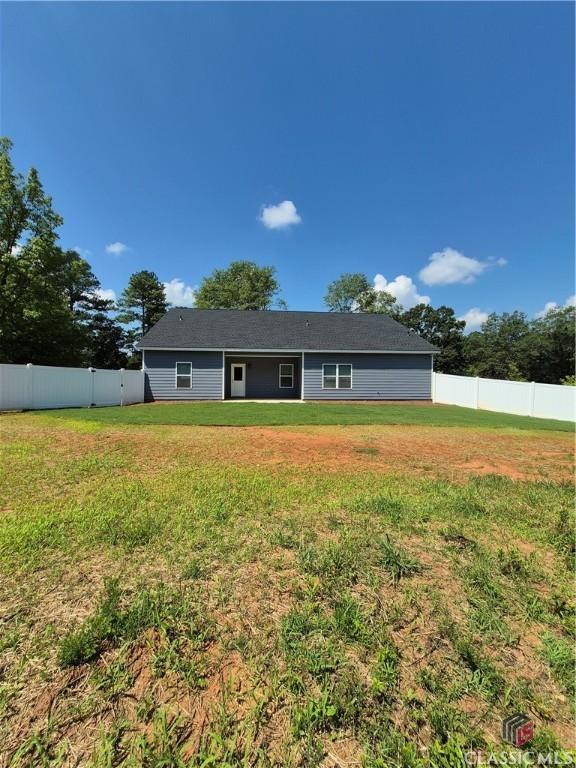1090 Fox Glen Dr, Watkinsville, GA 30677 - back of house with a fenced backyard