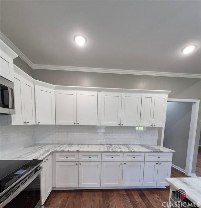 1090 Fox Glen Dr, Watkinsville, GA 30677 - kitchen featuring stainless steel appliances, crown molding, white cabinets, backsplash, and light stone counters