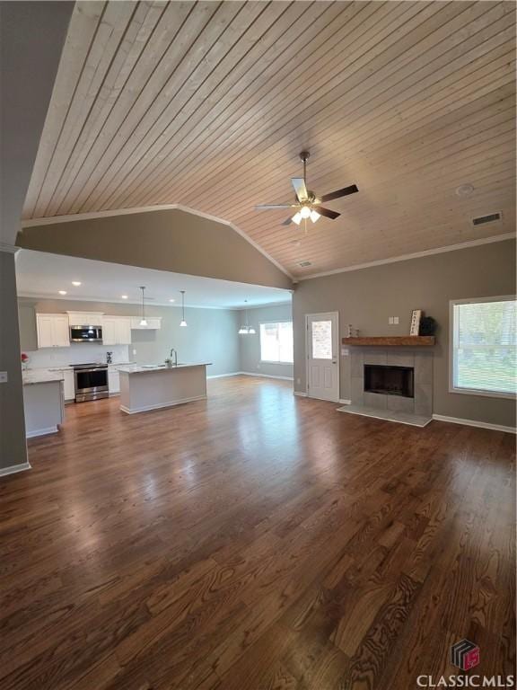 1070 Lane Creek Ter, Bishop, GA 30621 - unfurnished living room featuring wood ceiling, vaulted ceiling, ceiling fan, a tile fireplace, and ornamental molding