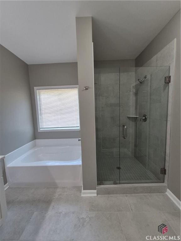 1070 Lane Creek Ter, Bishop, GA 30621 - full bathroom featuring a bath, a shower stall, and tile patterned flooring