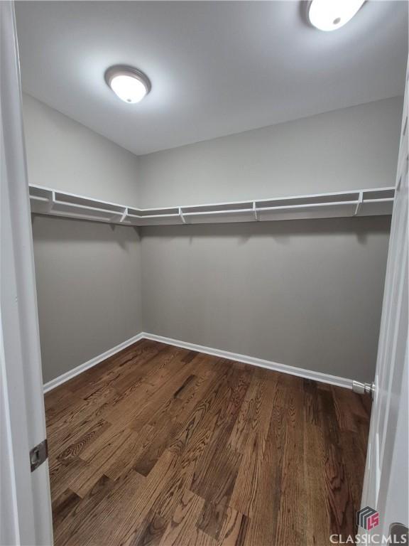 1070 Lane Creek Ter, Bishop, GA 30621 - spacious closet with dark wood-style floors