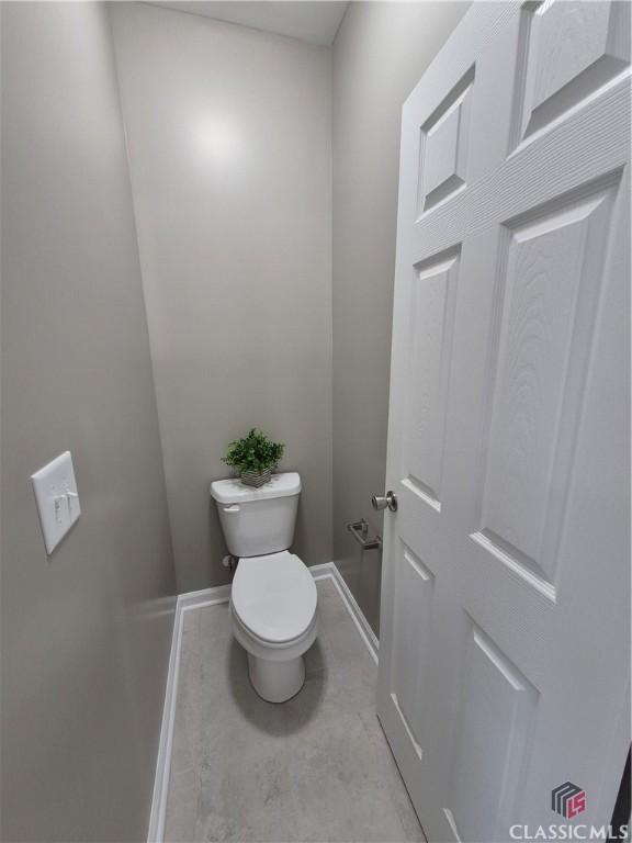 1070 Lane Creek Ter, Bishop, GA 30621 - bathroom featuring baseboards and toilet