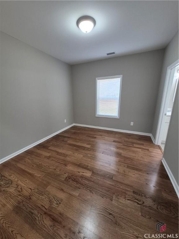 1070 Lane Creek Ter, Bishop, GA 30621 - unfurnished room featuring dark wood finished floors and baseboards