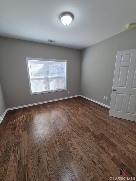 1070 Lane Creek Ter, Bishop, GA 30621 - unfurnished room featuring dark wood-style flooring
