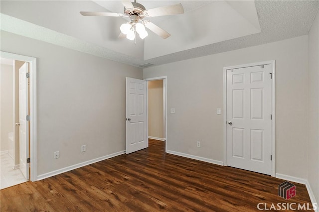 94 Pinewood Cir, Colbert, GA 30628 - unfurnished bedroom with dark wood-style flooring, ensuite bathroom, and a ceiling fan