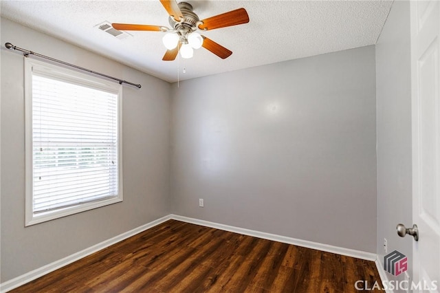 94 Pinewood Cir, Colbert, GA 30628 - unfurnished room with dark wood-style flooring, ceiling fan, and a textured ceiling