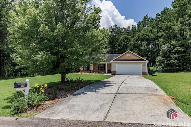 94 Pinewood Cir, Colbert, GA 30628 - view of front of home with an attached garage, a front lawn, and driveway