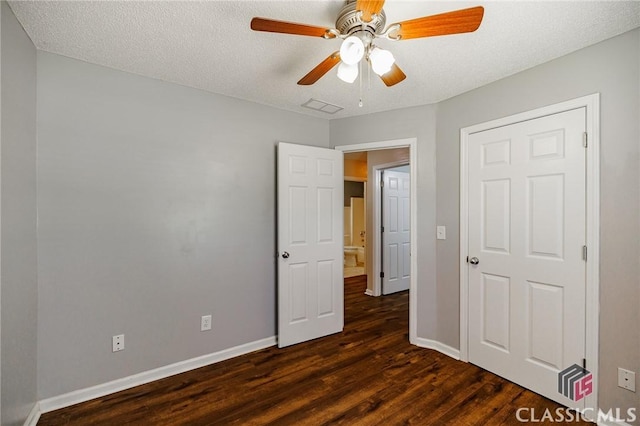 94 Pinewood Cir, Colbert, GA 30628 - unfurnished bedroom with dark wood finished floors, a textured ceiling, and ceiling fan