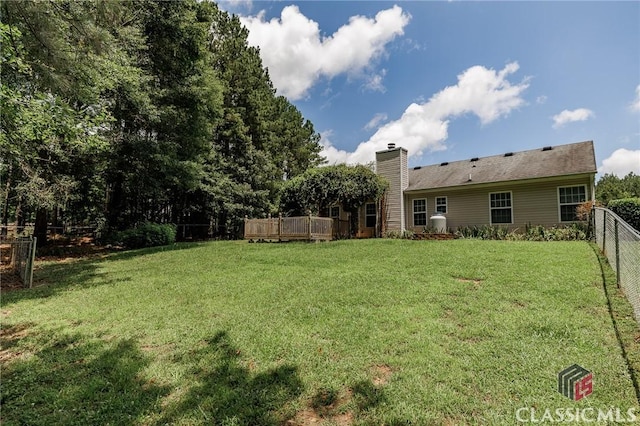 94 Pinewood Cir, Colbert, GA 30628 - fenced backyard with a deck