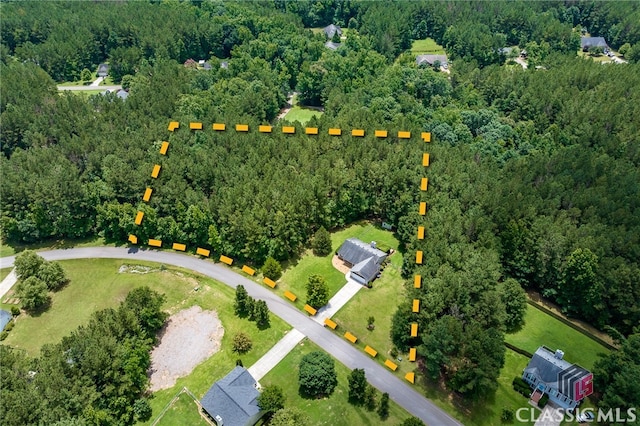 94 Pinewood Cir, Colbert, GA 30628 - view of property location with a heavily wooded area