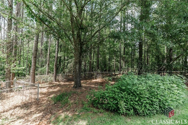 94 Pinewood Cir, Colbert, GA 30628 - view of tree filled area
