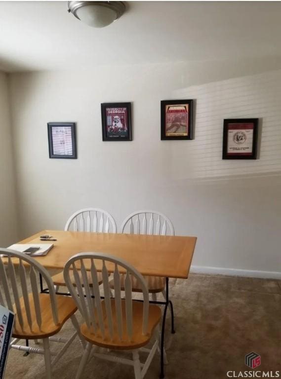 250 Little St Unit C210, Athens, GA 30605 - carpeted dining room featuring baseboards