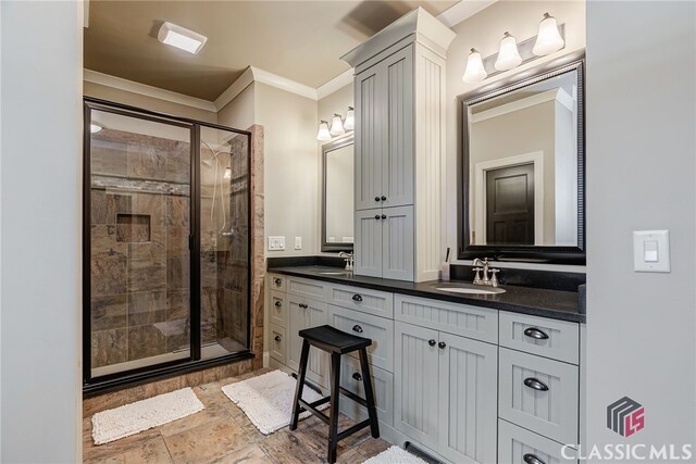 1640 Madison Ct, Bogart, GA 30622 - full bath with double vanity, crown molding, a shower stall, and stone finish floors