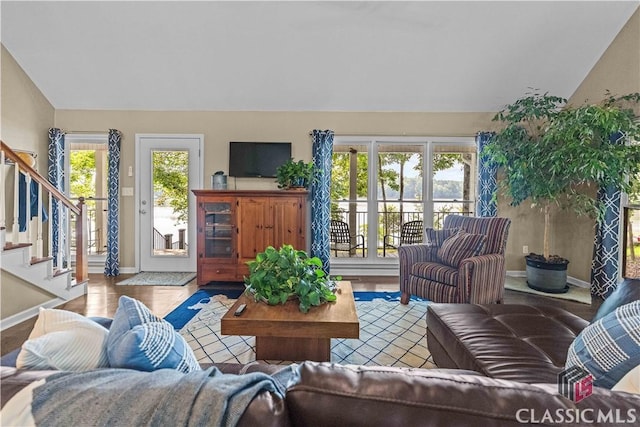 2061 Sugar Creek Trl, Buckhead, GA 30625 - living room featuring lofted ceiling, stairs, and wood finished floors